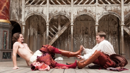 Lucentio (Joseph Timms) and Tranio (Jamie Beamish) exchange clothing in the 2012 Globe Production of Taming of the Shrew. 